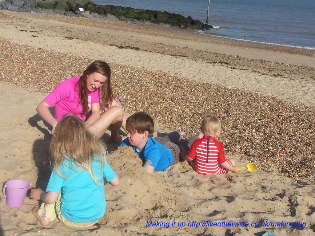 four on the beach in uv suits